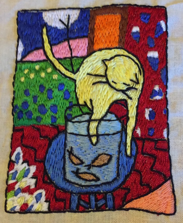 Gato y peces de colores bordado